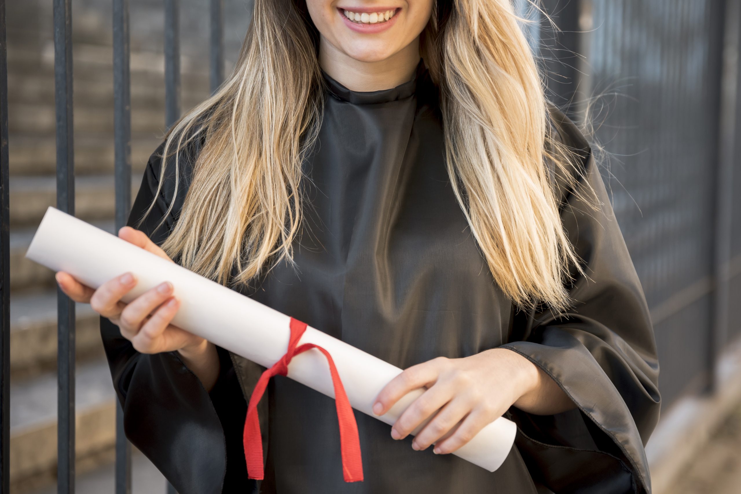 front-view-girl-smiling-holding-her-certificate