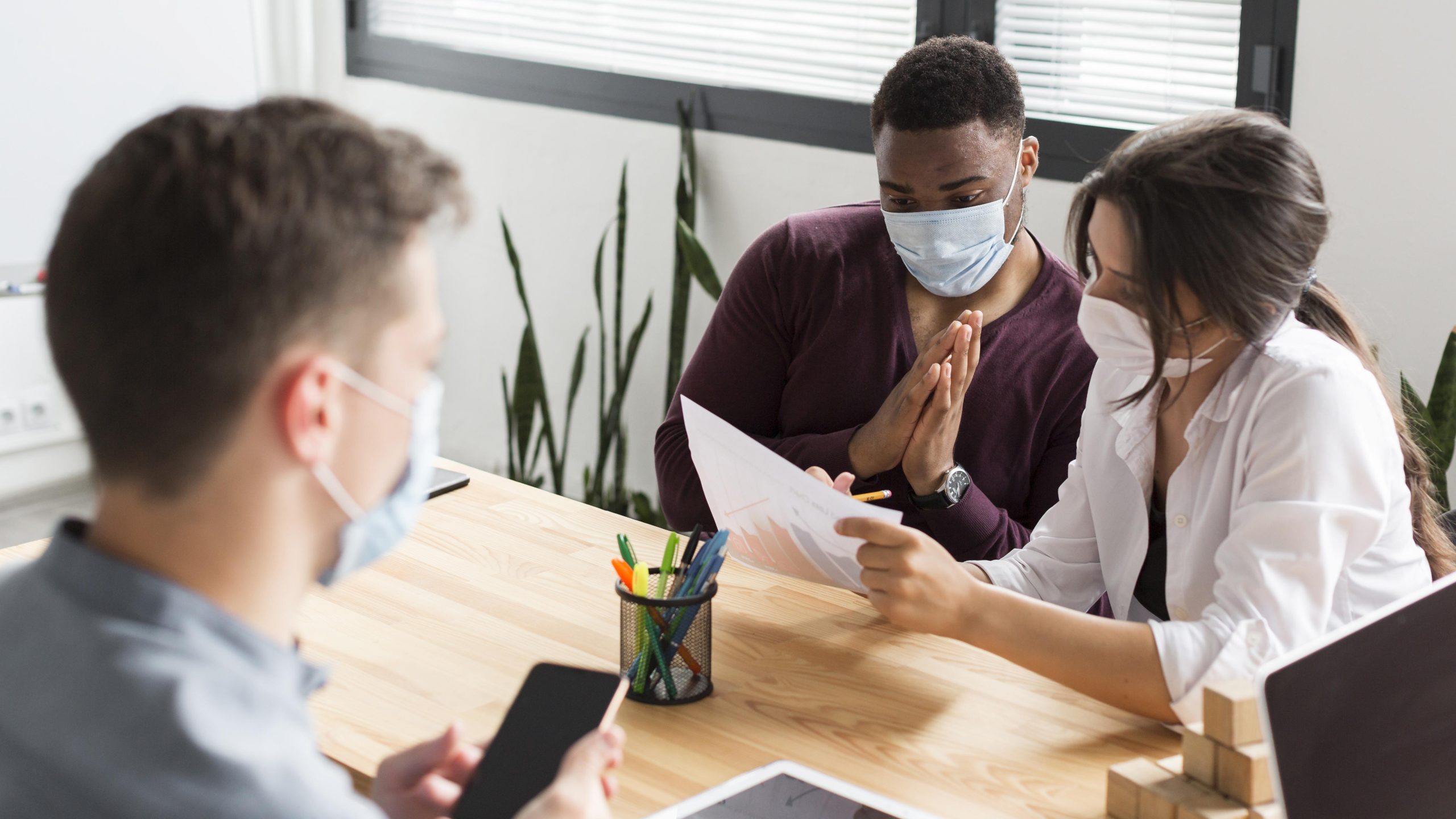 people-working-office-pandemic-with-masks